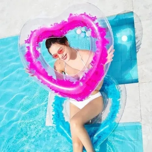 عوامة سباحة شفافة بتصميم قلب محشوه بالريش الملون 💖