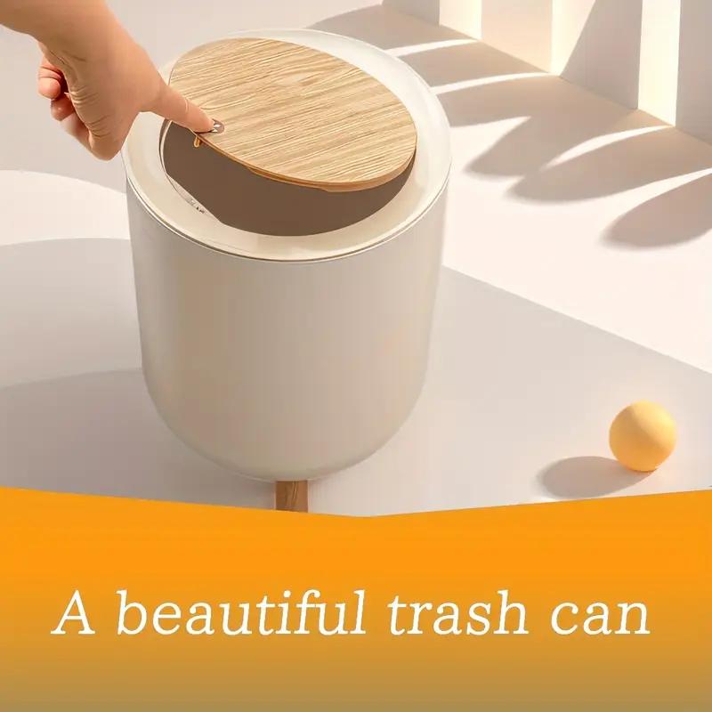 سلة نفايات عصرية بغطاء يعمل بالضغط وأرجل خشبية