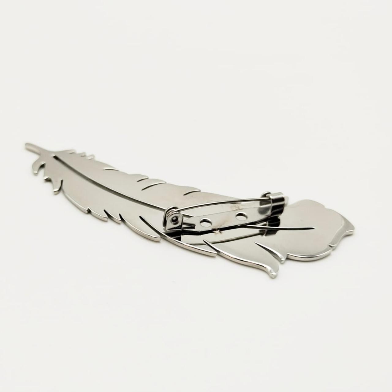 بروش بتصميم ريشة طائر ستانلس